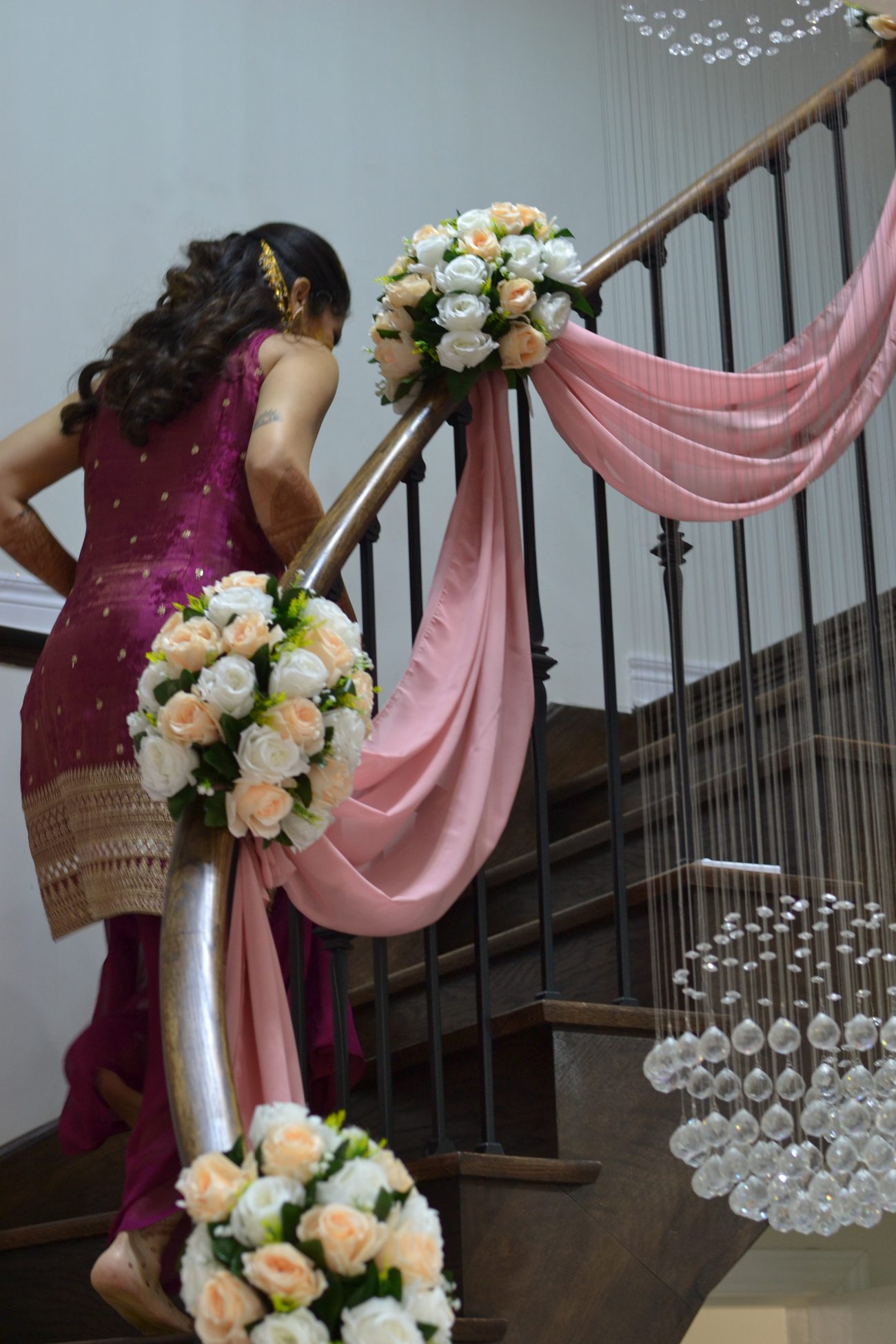 A hanging lantern against colourful drapes