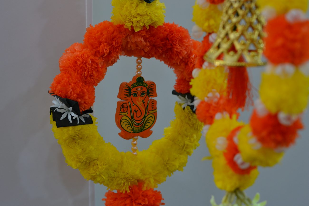 A marigold and Ganesh garland detail