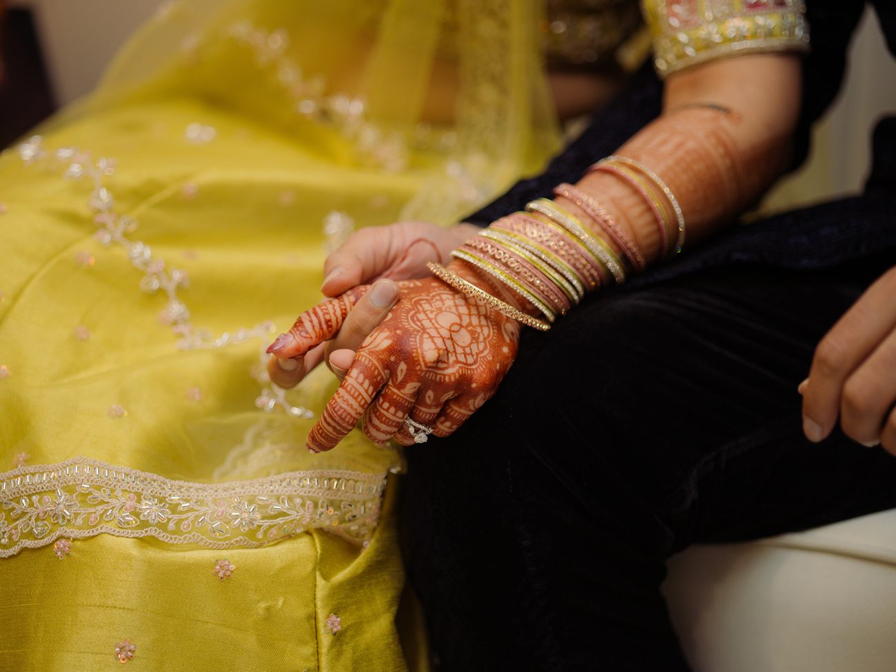 A bride addressing guests at her sangeet
